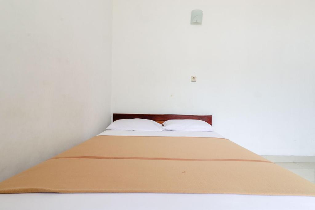 Voodi või voodid majutusasutuse Hotel Wismancala Kaliurang toas
