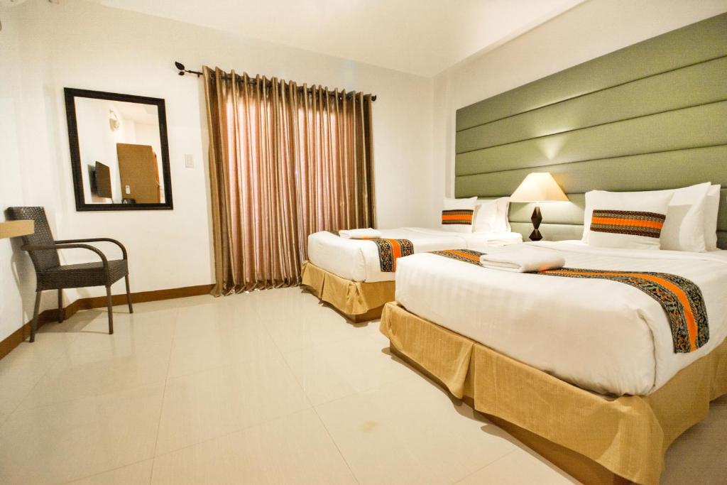 Postel nebo postele na pokoji v ubytování Sur Beach Resort Boracay