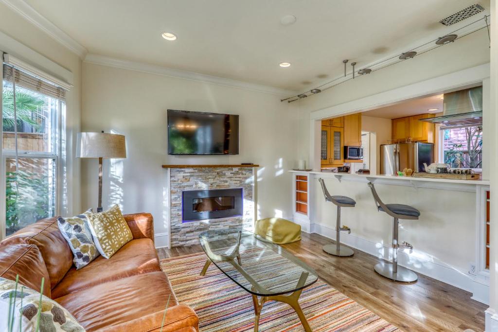 a living room with a couch and a fireplace at Fremont Oasis in Seattle