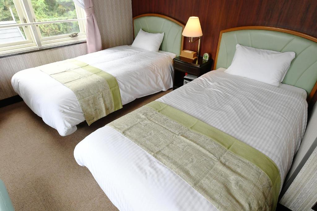 Postel nebo postele na pokoji v ubytování Hotel Ra Kuun