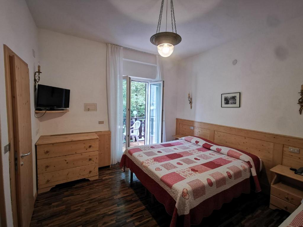 Postel nebo postele na pokoji v ubytování Lago Park Hotel