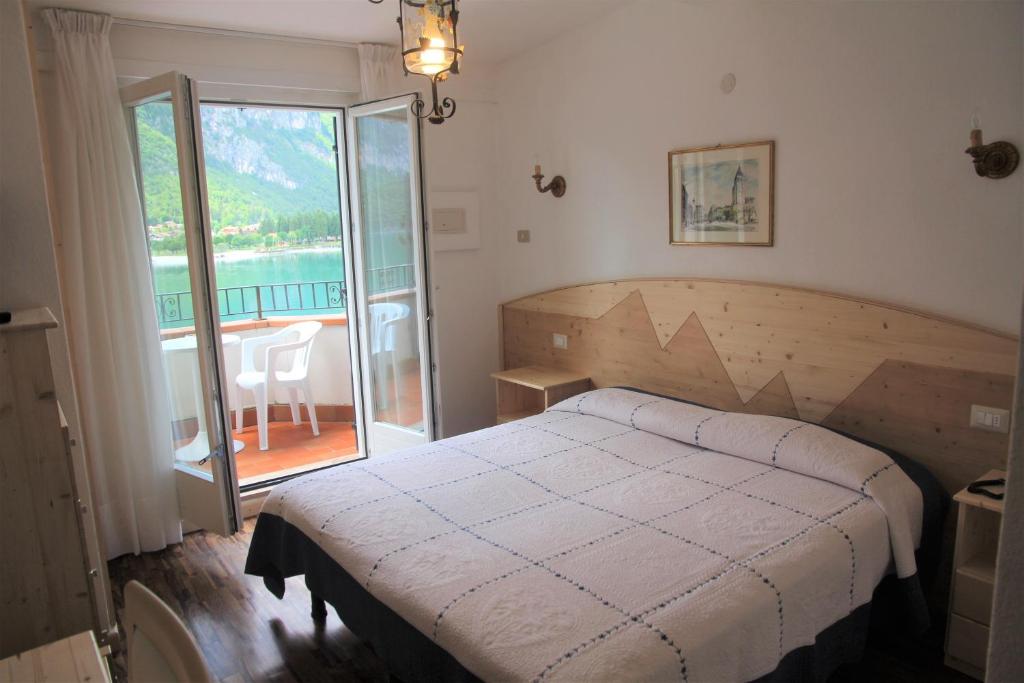 Postel nebo postele na pokoji v ubytování Lago Park Hotel