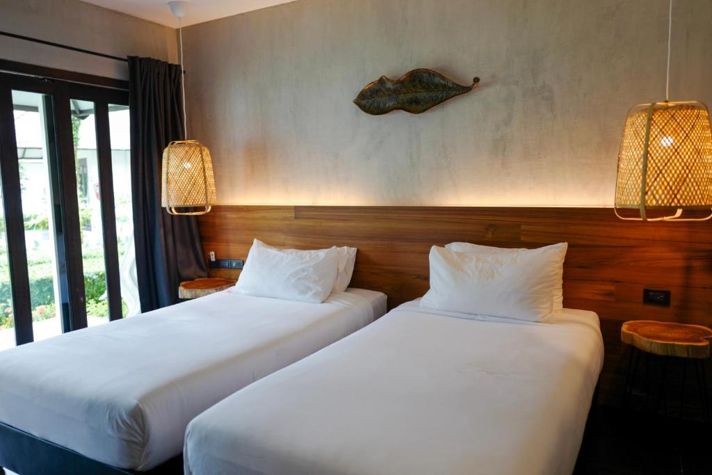 Кровать или кровати в номере Nature Beach Resort