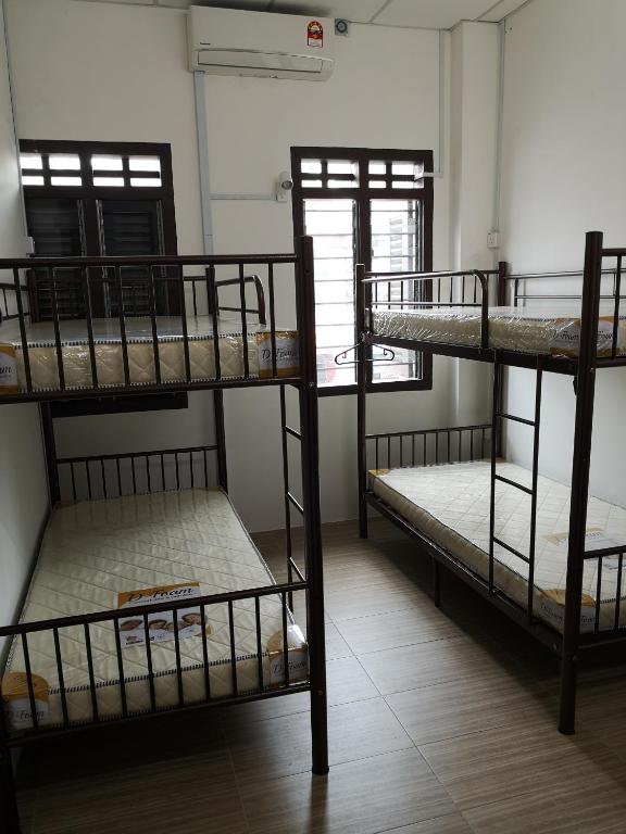 Postel nebo postele na pokoji v ubytování Homey Hostel, Ipoh Town