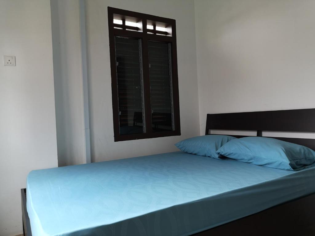 Postel nebo postele na pokoji v ubytování Homey Hostel, Ipoh Town