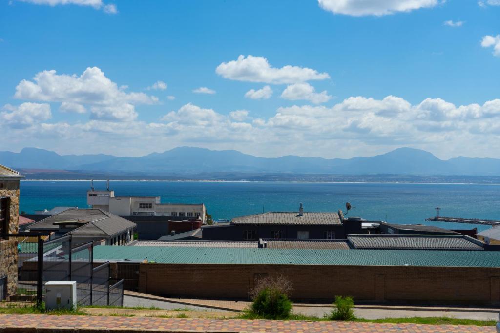 a view of a body of water with buildings at Bay Vista Guesthouse in Mossel Bay