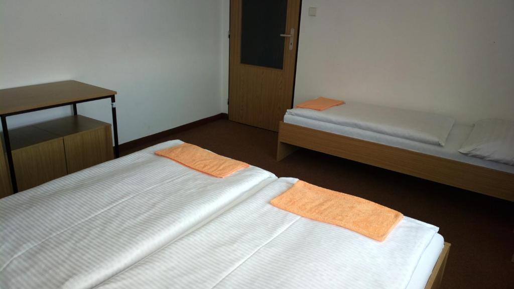 Postel nebo postele na pokoji v ubytování Penzion Lada