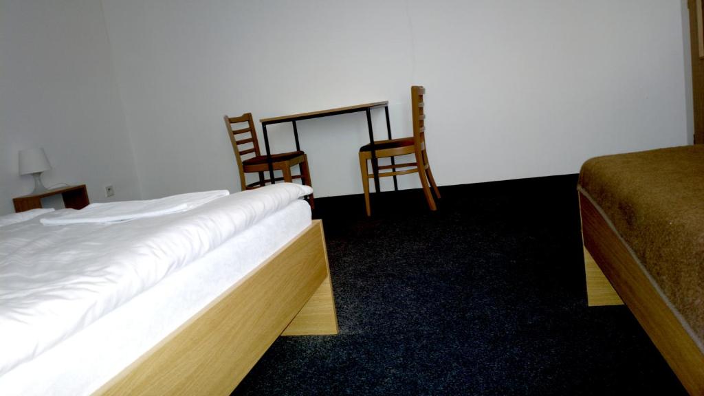 Postel nebo postele na pokoji v ubytování Penzion Lada