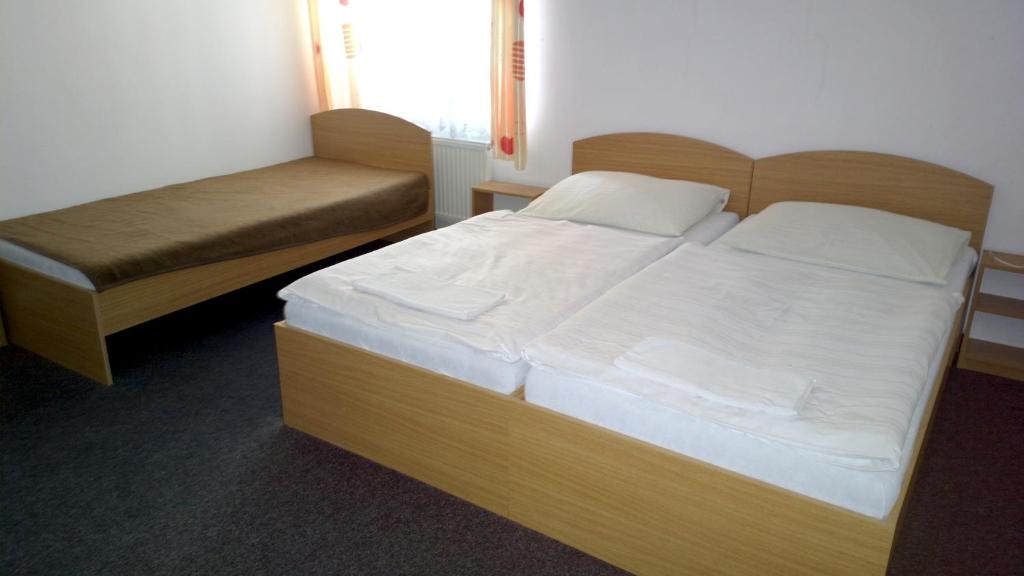 Postel nebo postele na pokoji v ubytování Penzion Lada