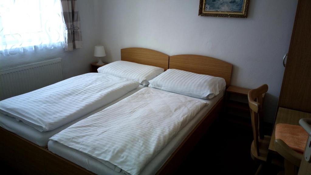 Postel nebo postele na pokoji v ubytování Penzion Lada