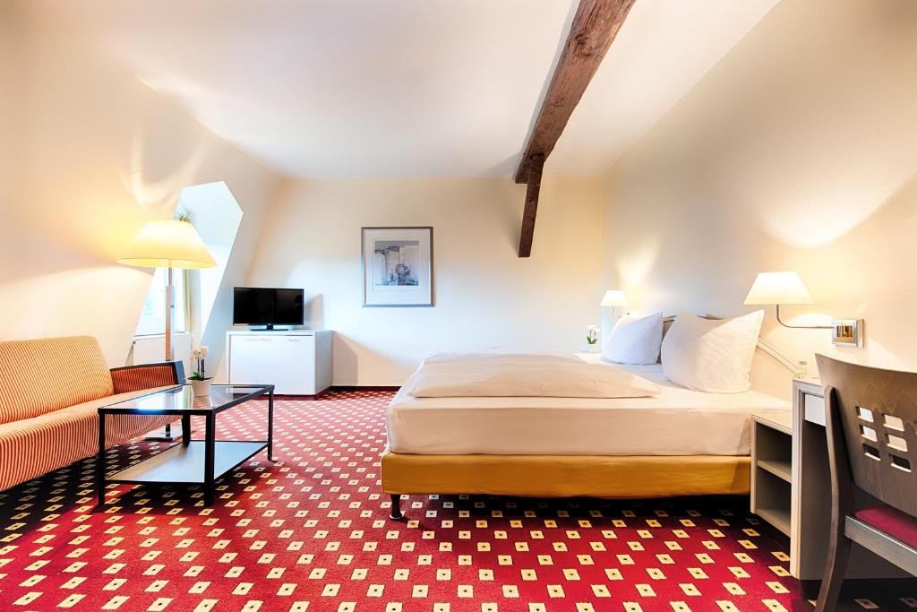 Postel nebo postele na pokoji v ubytování Welcome Hotel Bad Arolsen