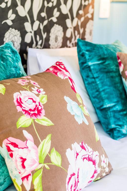 a bed with two pillows on top of it at Skyview Manor in Stellenbosch
