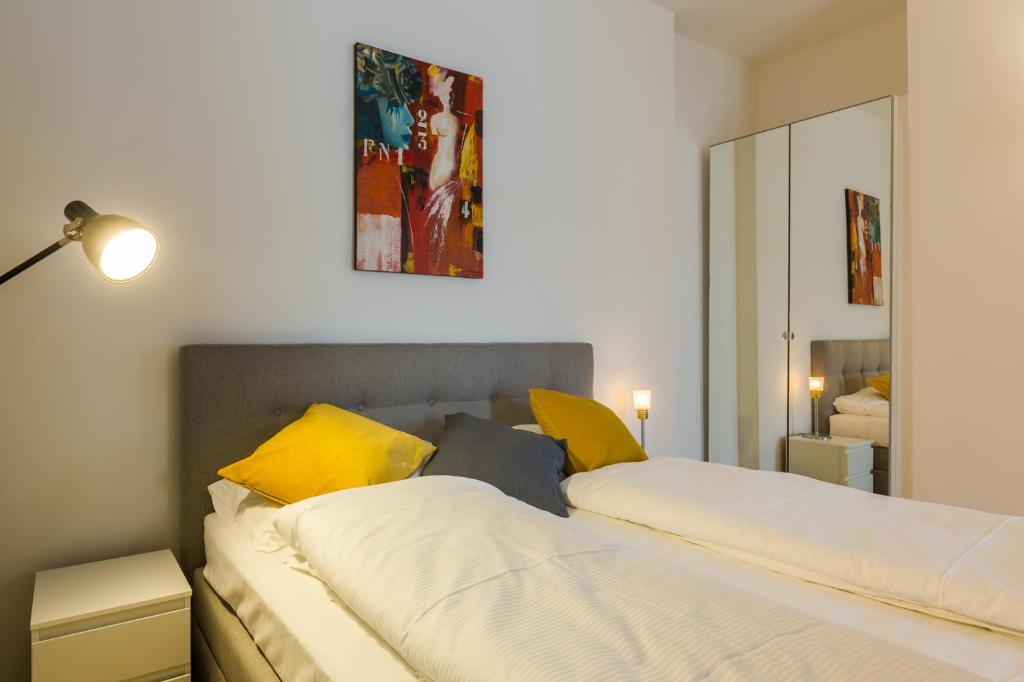 Posteľ alebo postele v izbe v ubytovaní Albergo Diffuso ELA Living - Design Apartment & Room
