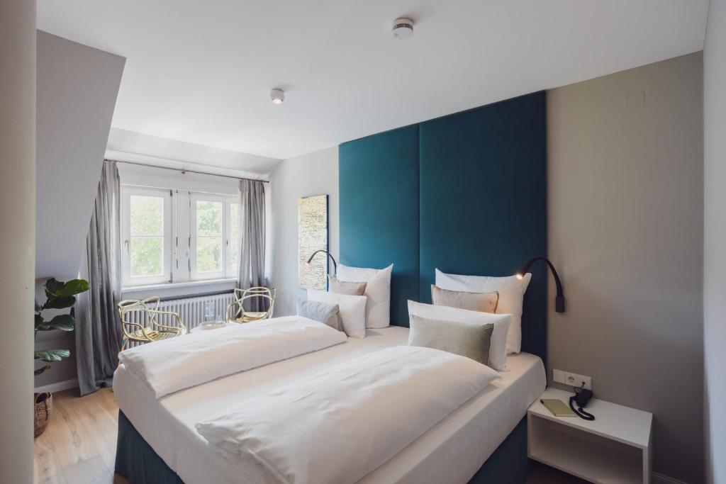 Postel nebo postele na pokoji v ubytování Hotel Caraleon