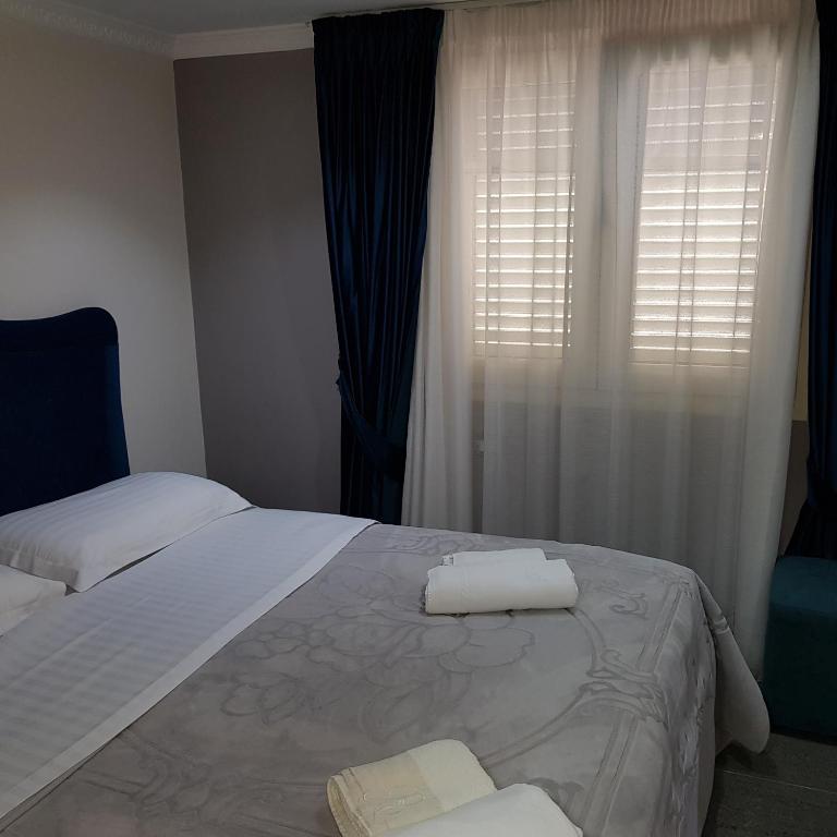 Postel nebo postele na pokoji v ubytování Hotel Erandi