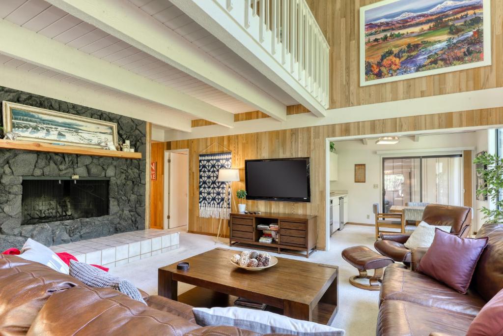 a living room with a couch and a fireplace at Golf Home 53 in Black Butte Ranch