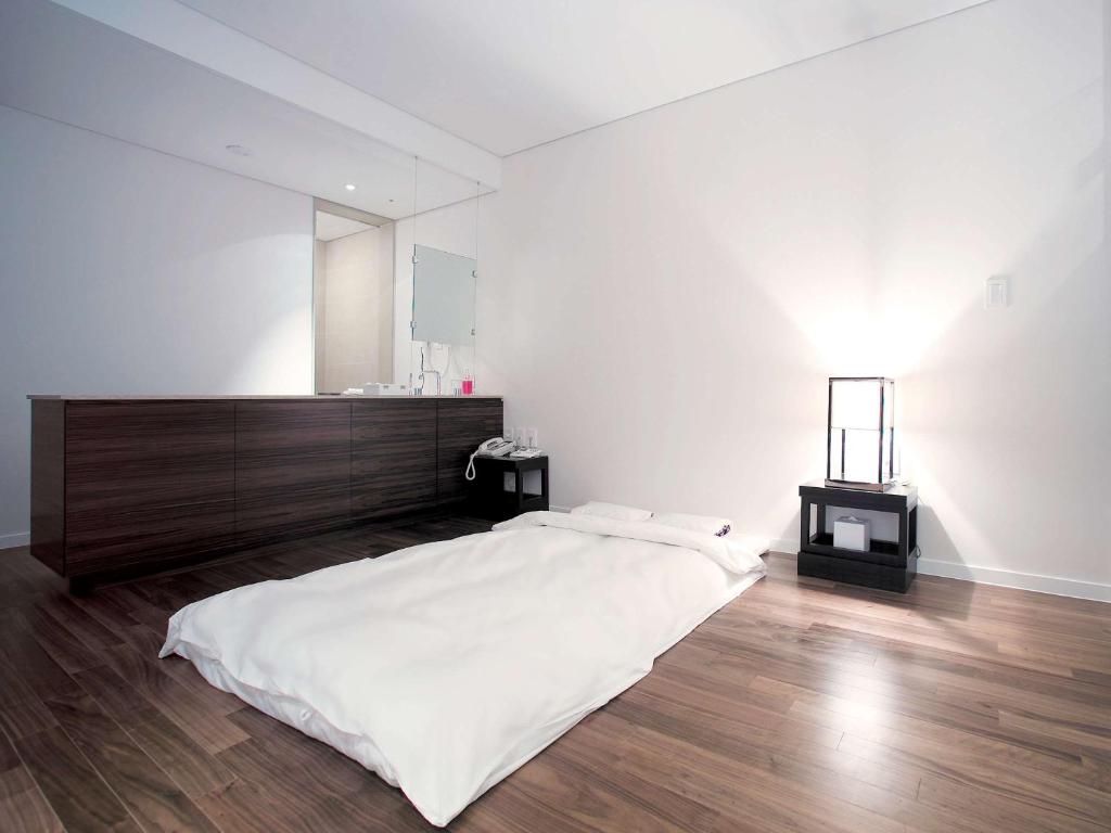 Postel nebo postele na pokoji v ubytování Grand Mercure Ambassador Changwon