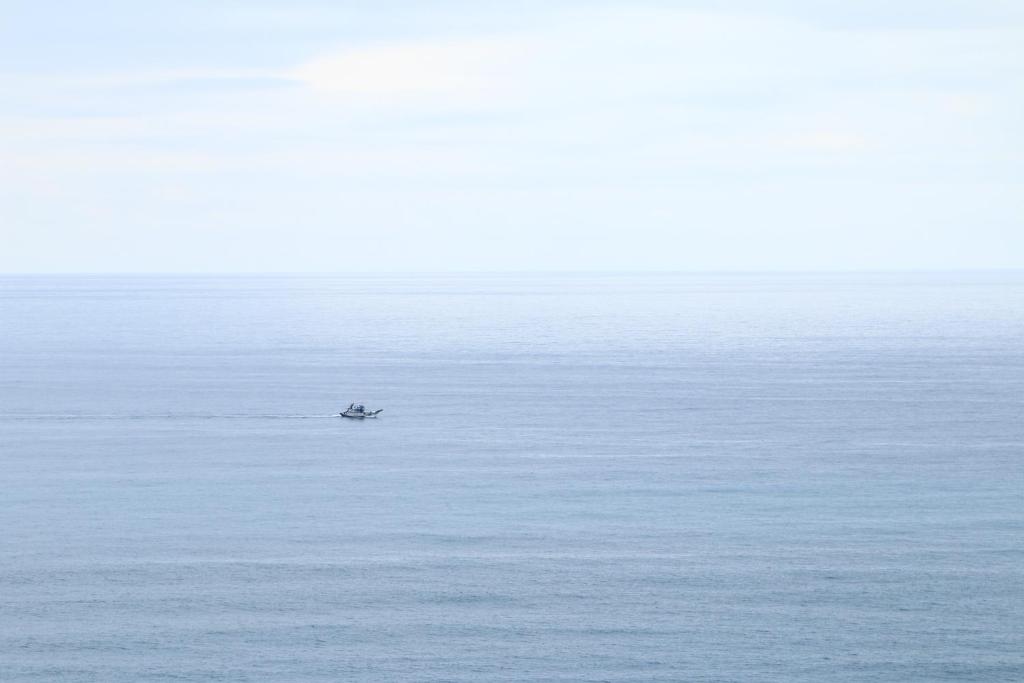 a small boat in the middle of the water at Fu Taitung Homestay in Taitung City