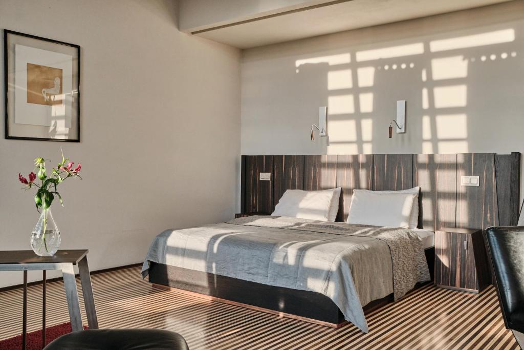 Postel nebo postele na pokoji v ubytování Hotel Monopol