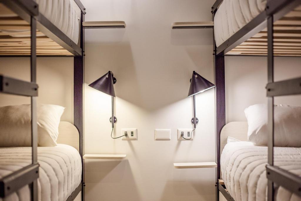 Postel nebo postele na pokoji v ubytování Hostal Boutique Black Cat