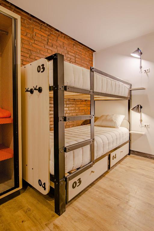 Postel nebo postele na pokoji v ubytování Hostal Boutique Black Cat