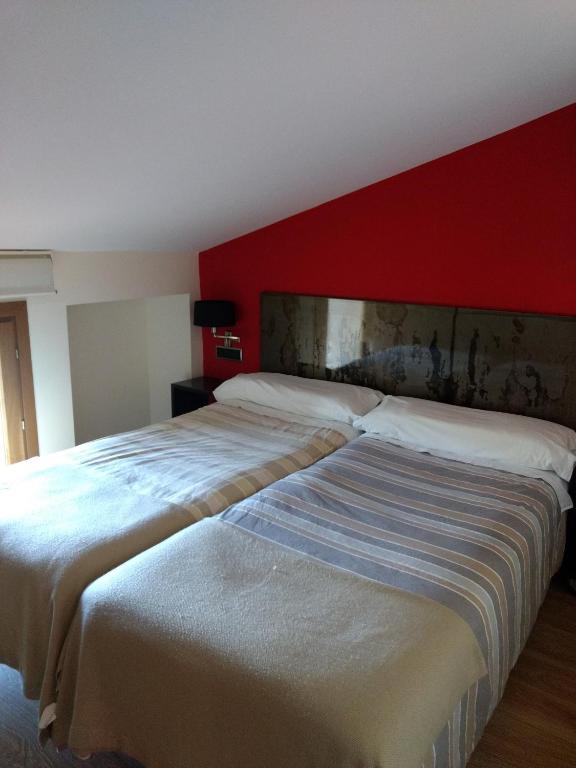 Postel nebo postele na pokoji v ubytování Alizaque Lodge