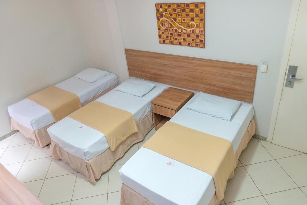 Postel nebo postele na pokoji v ubytování Hotel QualitySul