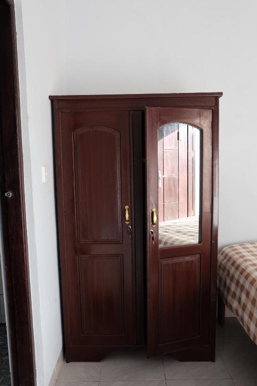 Postel nebo postele na pokoji v ubytování Rumah Marianne