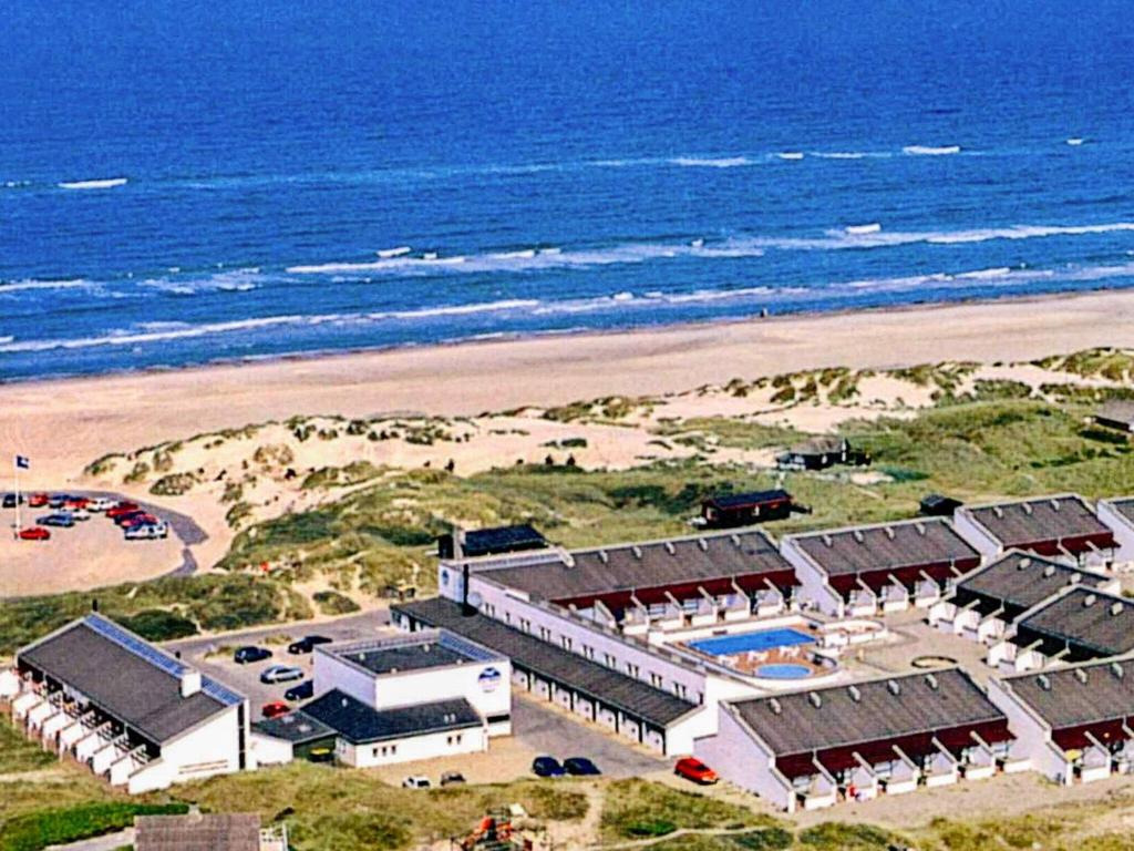 an aerial view of a resort on the beach at 6 person holiday home in Brovst in Brovst