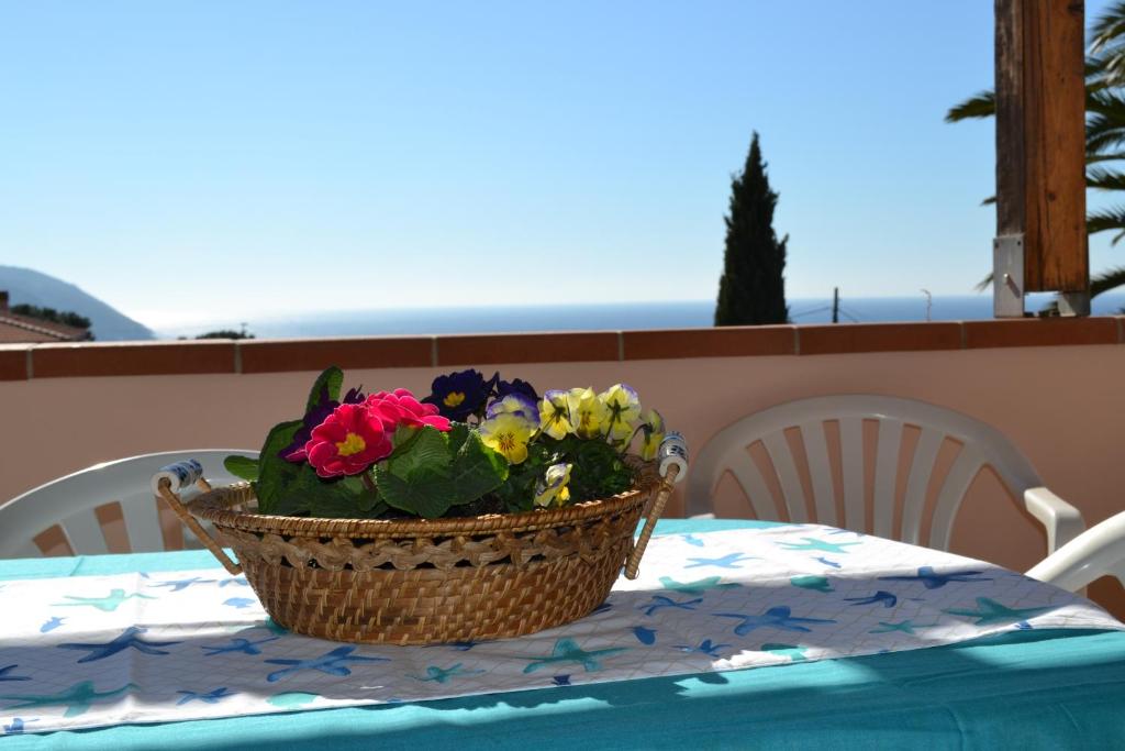 a basket of flowers sitting on a table at Stella in Lacona