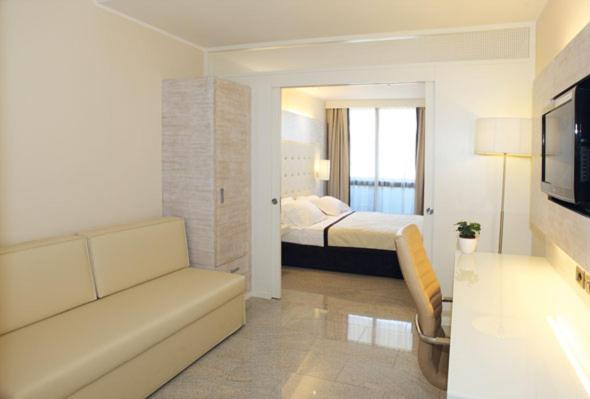 Łóżko lub łóżka w pokoju w obiekcie Hotel San Carlo