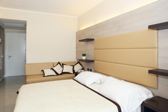 Łóżko lub łóżka w pokoju w obiekcie Hotel San Carlo