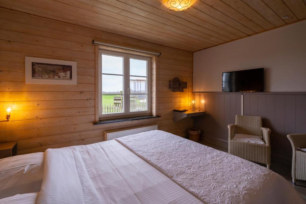 Postel nebo postele na pokoji v ubytování Gasthof Schraevenacker