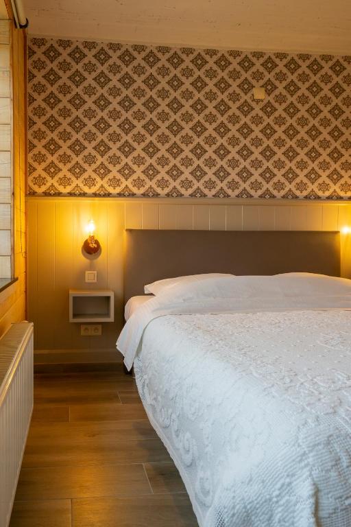 Postel nebo postele na pokoji v ubytování Gasthof Schraevenacker