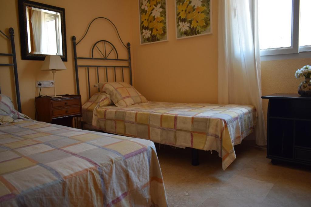 A bed or beds in a room at Anacasa Atlas Estrella de Mar AP2215