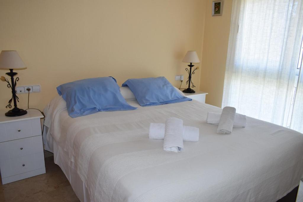 A bed or beds in a room at Anacasa Atlas Estrella de Mar AP2215