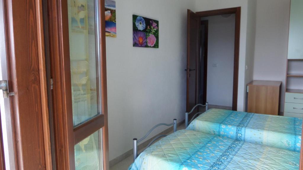 Letto o letti in una camera di B&B La Posada Stintino