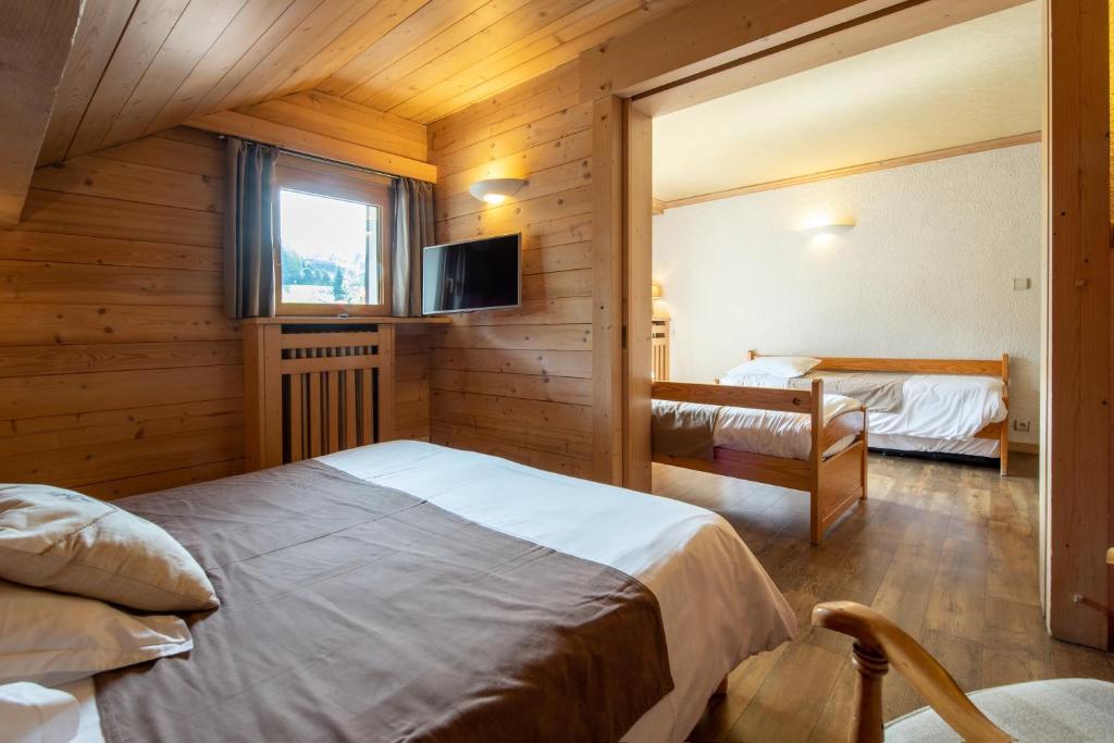 Postel nebo postele na pokoji v ubytování Hôtel La Montagne
