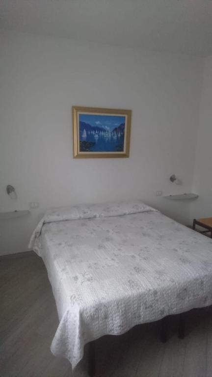 Postel nebo postele na pokoji v ubytování Hotel Lory