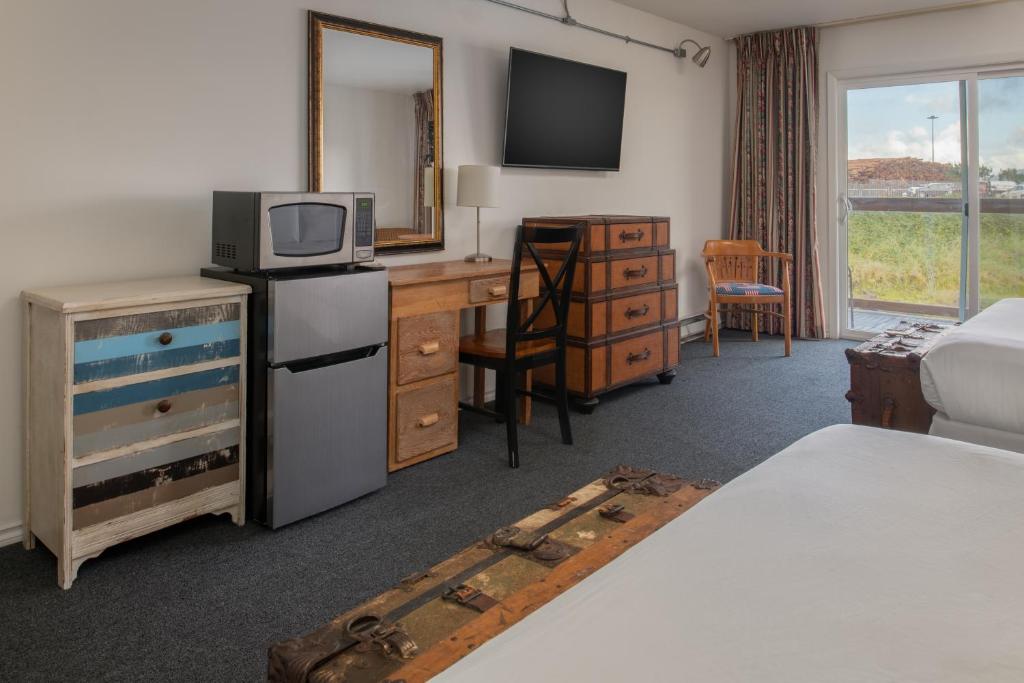 Postel nebo postele na pokoji v ubytování Astoria Riverwalk Inn