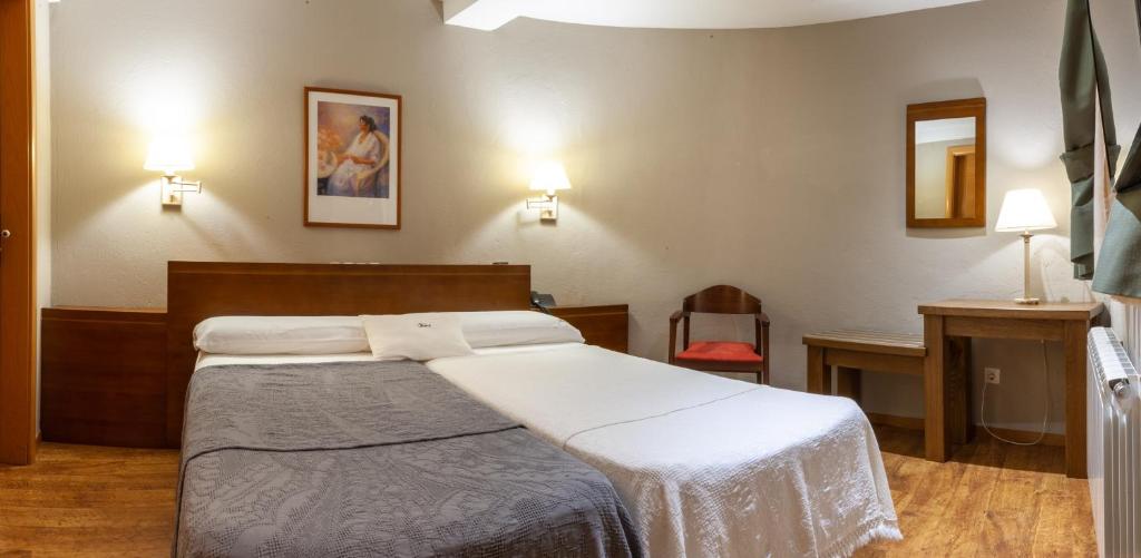 Posteľ alebo postele v izbe v ubytovaní Hotel Fonda Merce