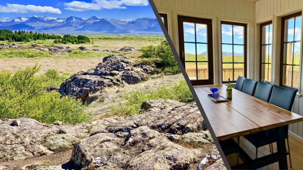 a dining room with a view of the mountains at Lundur in Borgarnes