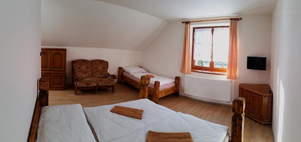 Postel nebo postele na pokoji v ubytování Apartmány Šachty