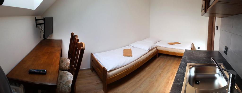 Postel nebo postele na pokoji v ubytování Apartmány Šachty