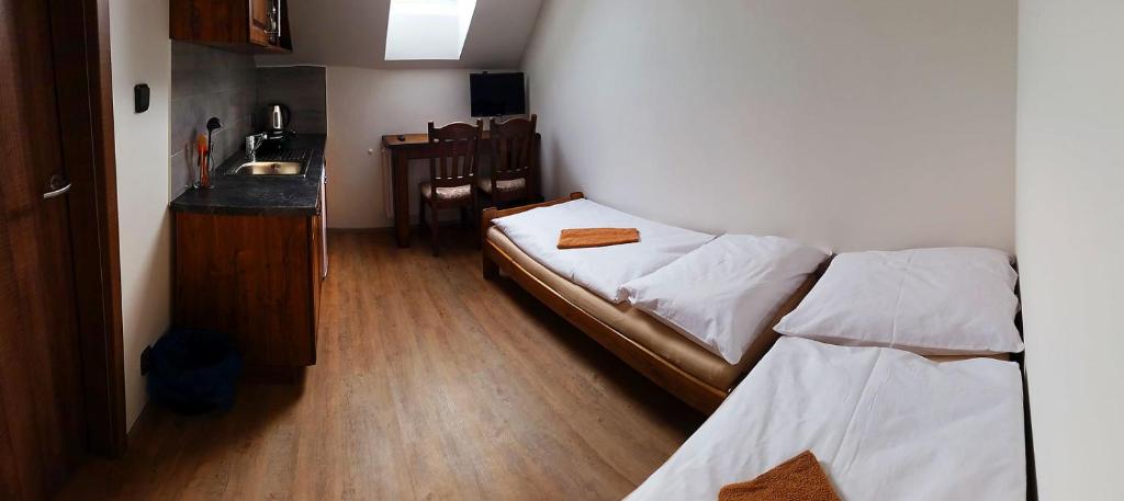 Postel nebo postele na pokoji v ubytování Apartmány Šachty