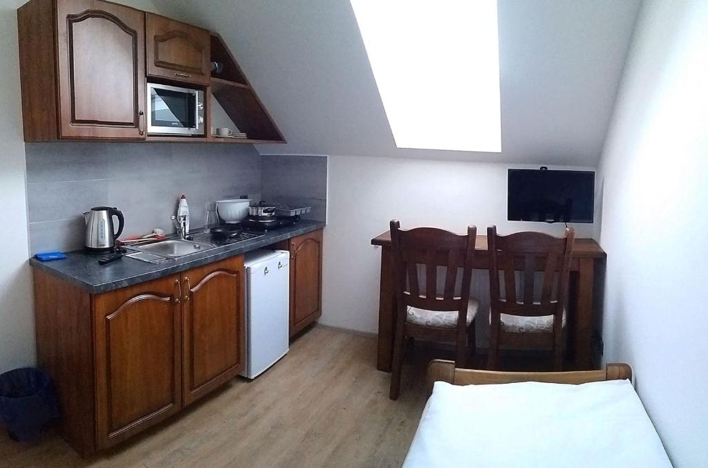 Kuchyň nebo kuchyňský kout v ubytování Apartmány Šachty