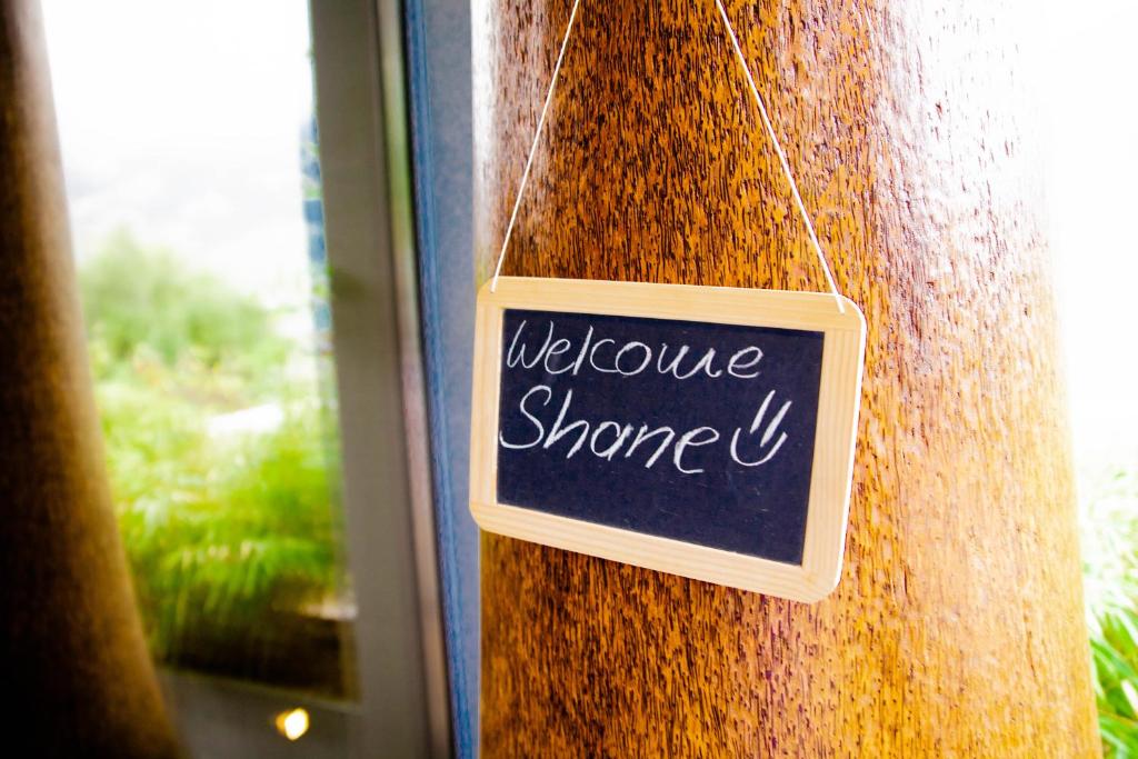 a sign on a wall that says welcome stronger at Luxury loft on top of Villa Wilen with tremendous views by the lake in Sarnen