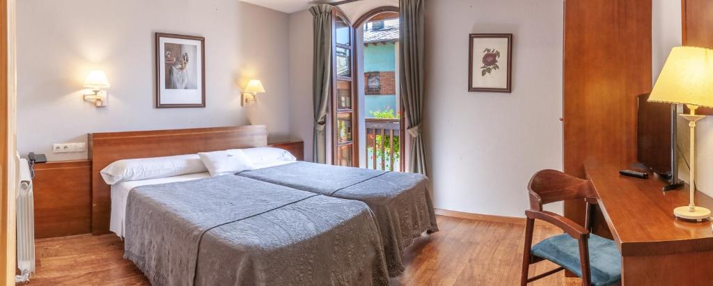 Posteľ alebo postele v izbe v ubytovaní Hotel Fonda Merce