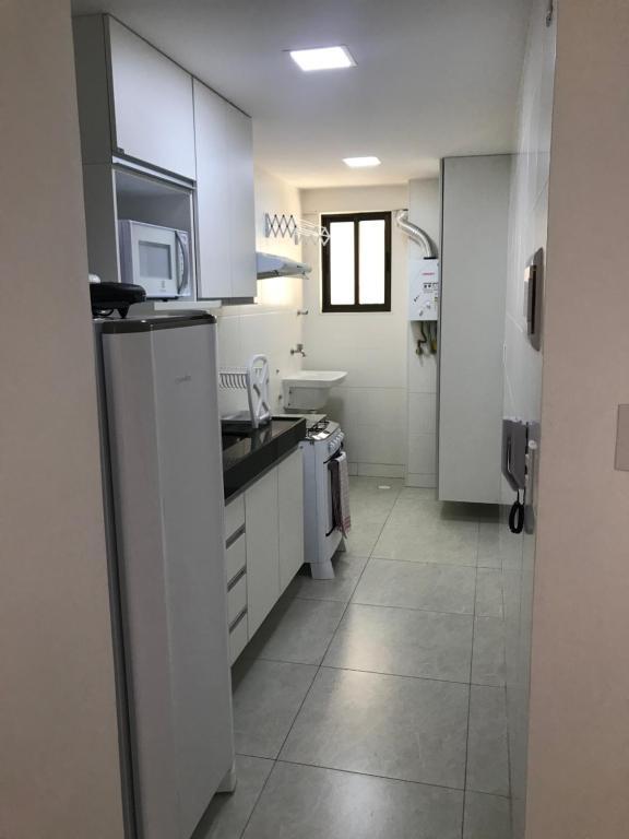 Kuchyň nebo kuchyňský kout v ubytování Apartamento Completo Jatiúca
