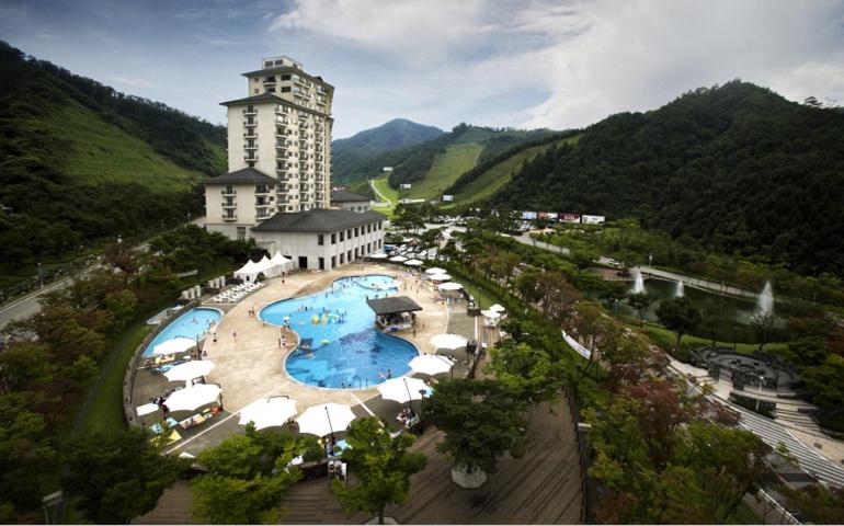an aerial view of a resort with a swimming pool at Elysian Gangchon Resort in Chuncheon